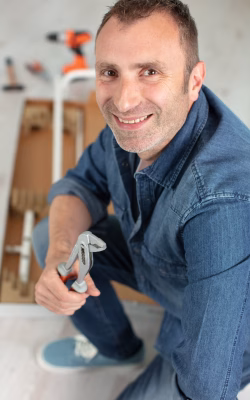 happy man making repairs to his home